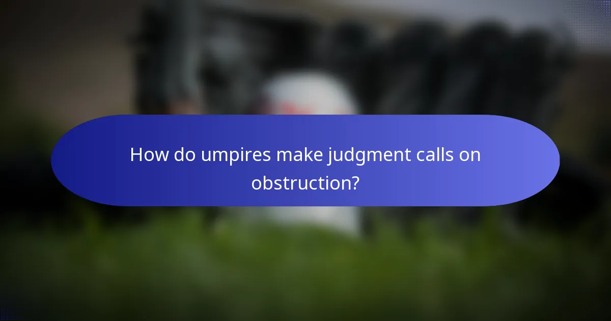 How do umpires make judgment calls on obstruction?